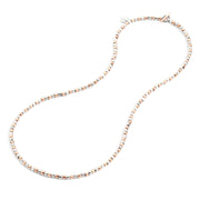 Gioiello collana in argento e oro rosa, catena con minigranelli ispirati alla sabbia, elegante e versatile.